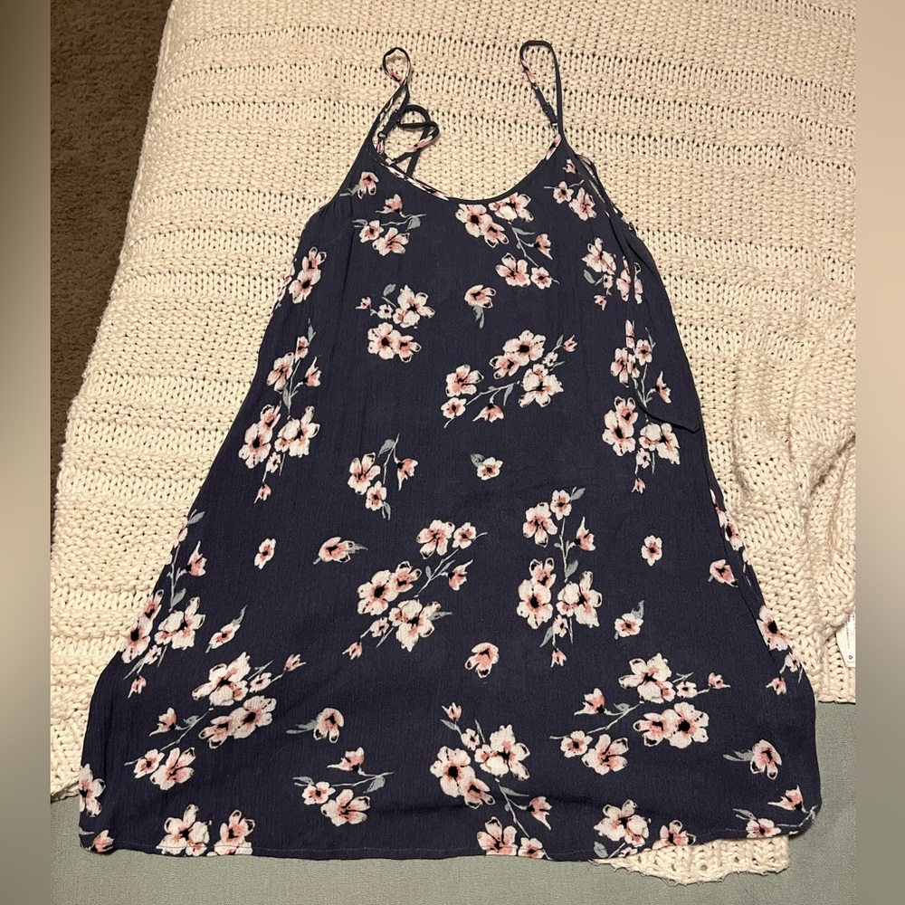 Garage blue summer dress with floral pattern with a tie back.